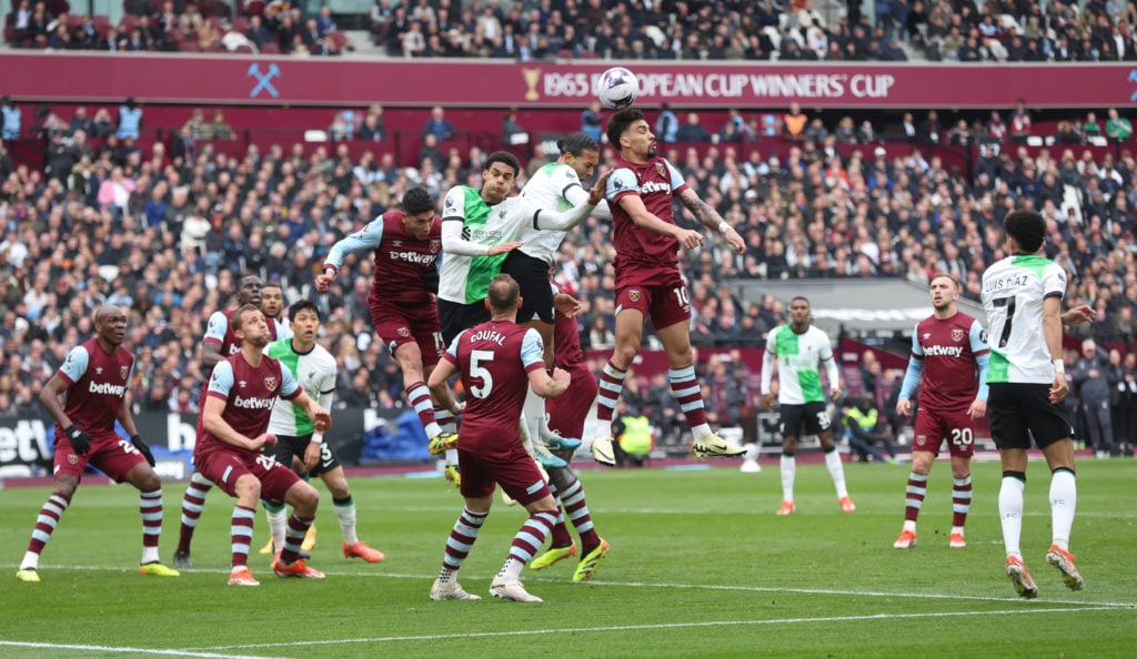 West Ham United's Lucas Paqueta and Edson Alvarez challenge Liverpool's Virgil van Dijk and Jarell Quansah during the Premier League match between ...