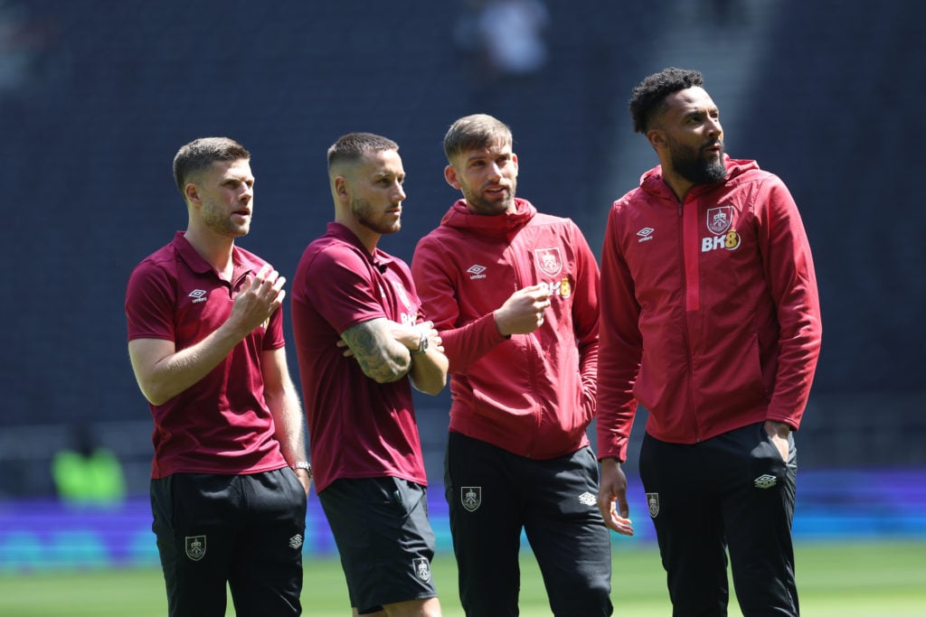 Johann Gudmundsson, Josh Brownhill, Charlie Taylor and Lawrence Vigouroux of Burnley interact during a pitch inspection prior to the Premier League...