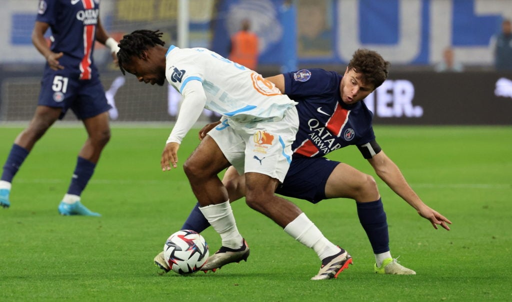 Joao Neves #87 of Paris Saint-Germain in action with Elye Wahi 9 of Marseille during the Ligue 1 McDonald's match between Olympique de Marseille an...