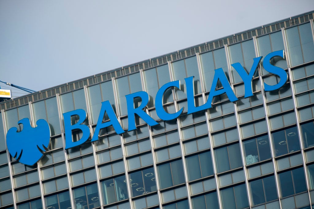 Sign for the brand and high street bank Barclays outside their Barclays Corporate Banking headquarters at the heart of Canary Wharf financial distr...