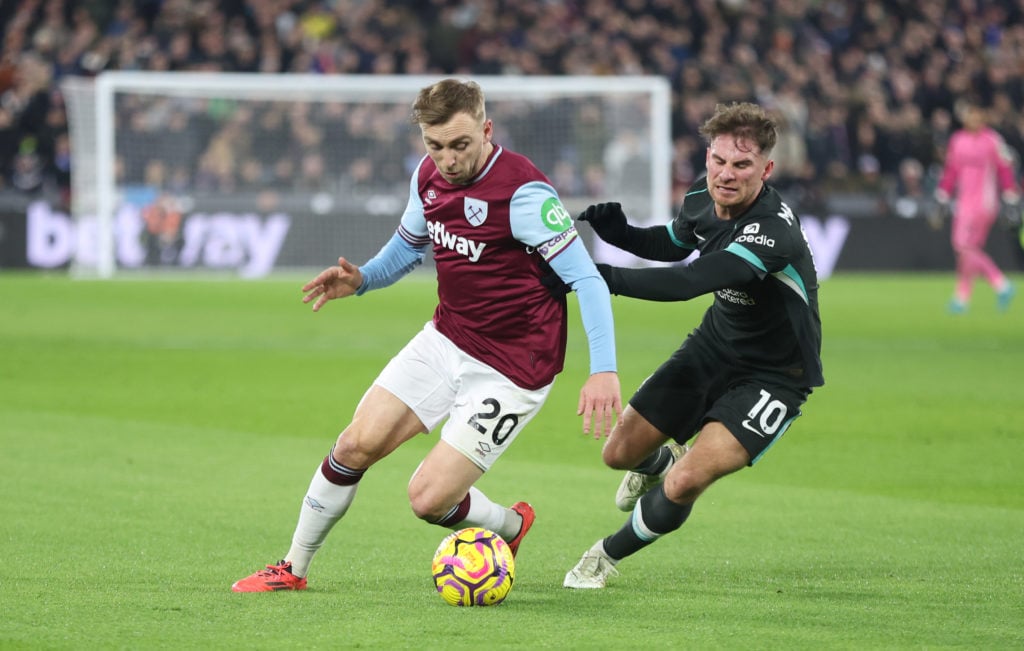 West Ham United's Jarrod Bowen and Liverpool's Alexis Mac Allister during the Premier League match between West Ham United FC and Liverpool FC at L...