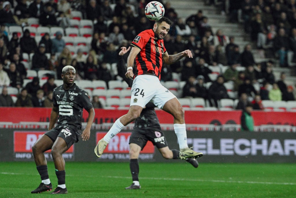 Nice's French forward #24 Gaetan Laborde heads the ball during the French L1 football match between OGC Nice and Stade Rennais Football Club at the...