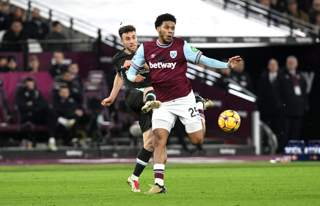 (SUN AND SUN ON SUNDAY OUT) Diogo Jota of Liverpool shoots under pressure from Jean-Clair Todibo of West Ham United during the Premier League match...