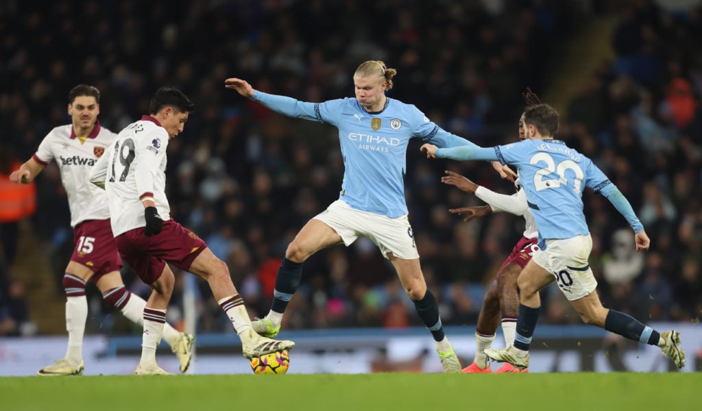 Manchester City's Erling Halaand and West Ham United's Edson Alvarez during the Premier League match between Manchester City FC and West Ham United...