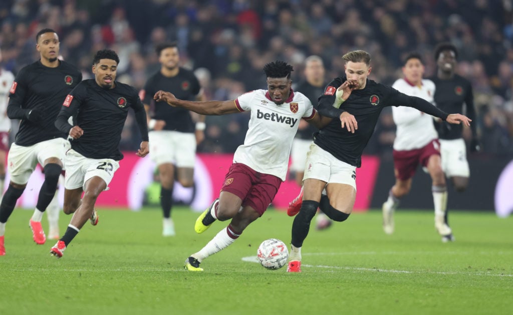 West Ham United's Mohammed Kudus and Aston Villa's Matty Cash during the Emirates FA Cup Third Round match between Aston Villa and West Ham United ...