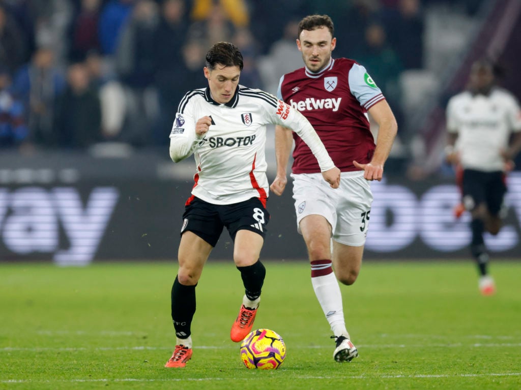 Harry Wilson of Fulham and Andy Irving of West Ham United challenge during the Premier League match between West Ham United FC and Fulham FC at Lon...