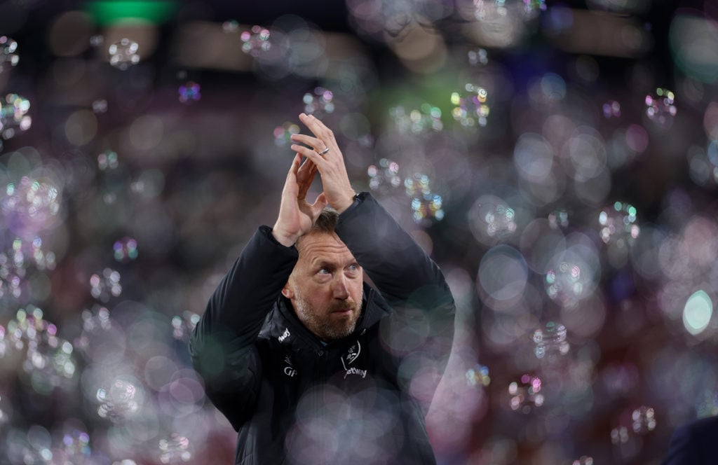 Graham Potter, Head Coach of West Ham United acknowledges the fans as he is surrounded by bubbles ahead of the Premier League match between West Ha...