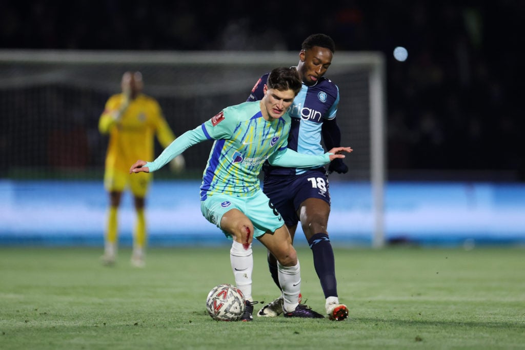 Freddie Potts of Portsmouth controls the ball whilst under pressure from Brandon Hanlan of Wycombe Wanderers during the Emirates FA Cup Third Round...