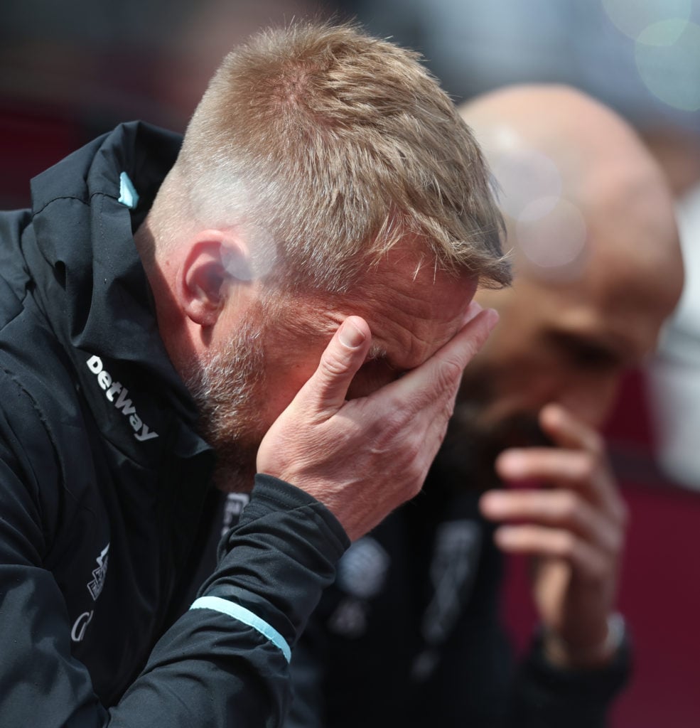 A dejected West Ham head coach Graham Potter holds his hand to his face