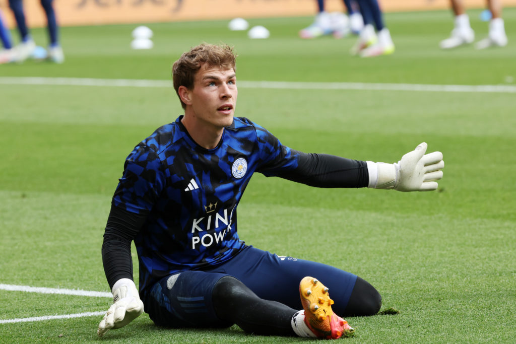 Leicester City goalkeeper Mads Hermansen gets warmed up before a game