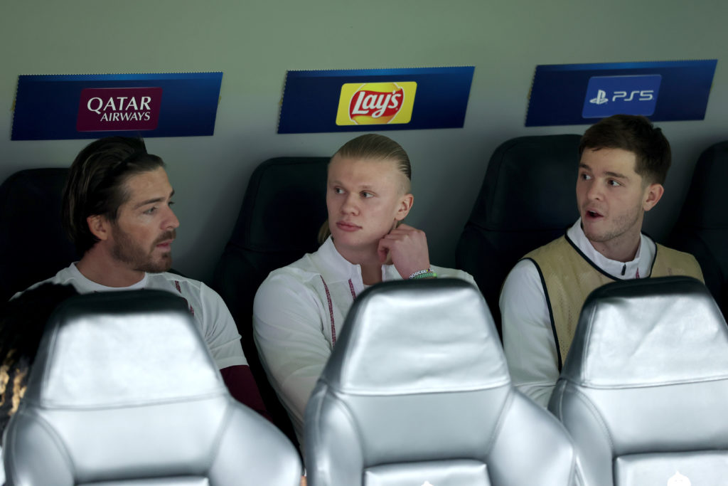 Jack Grealish and James McAtee either side of Erling Haaland on the bench for Manchester City