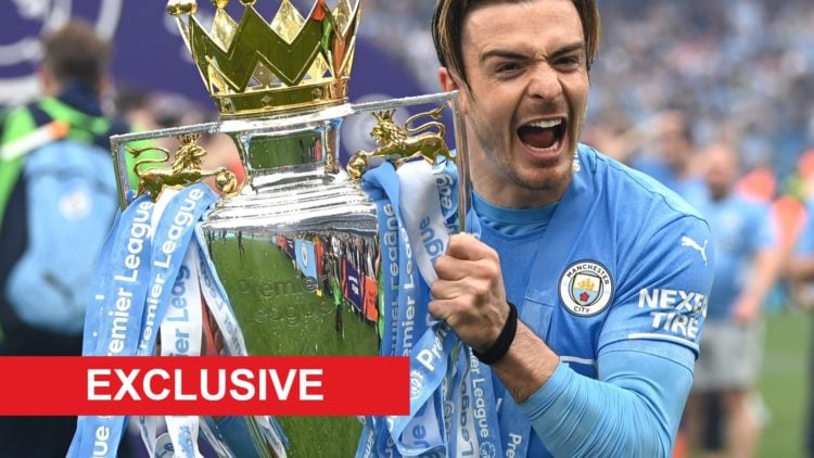 Jack Grealish celebrates as he lifts the Premier League trophy for Man City