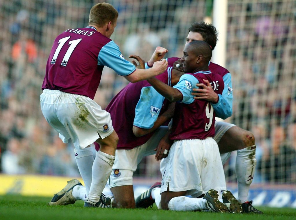 Frederic Kanoute of West Ham is congratulated by teammates Jermain Defoe and Steve Lomas