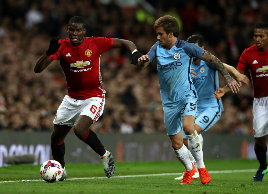 Paul Pogba and Aleix Garcia during Manchester United v Manchester City - EFL Cup Fourth Round