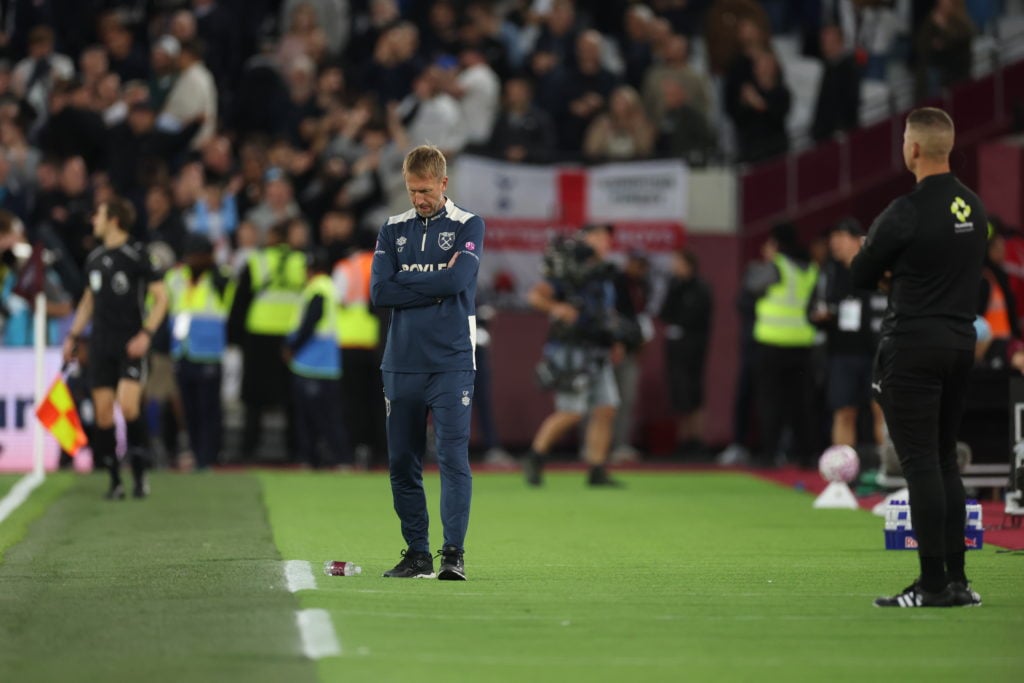 Graham Potter looks at the floor as West Ham are beaten by Tottenham Hotspur