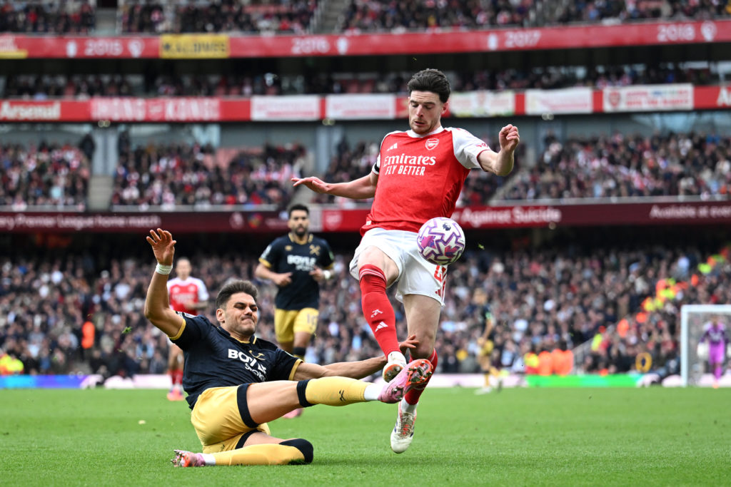 Konstantinos Mavropanos tackles Declan Rice in West Ham's loss at Arsenal