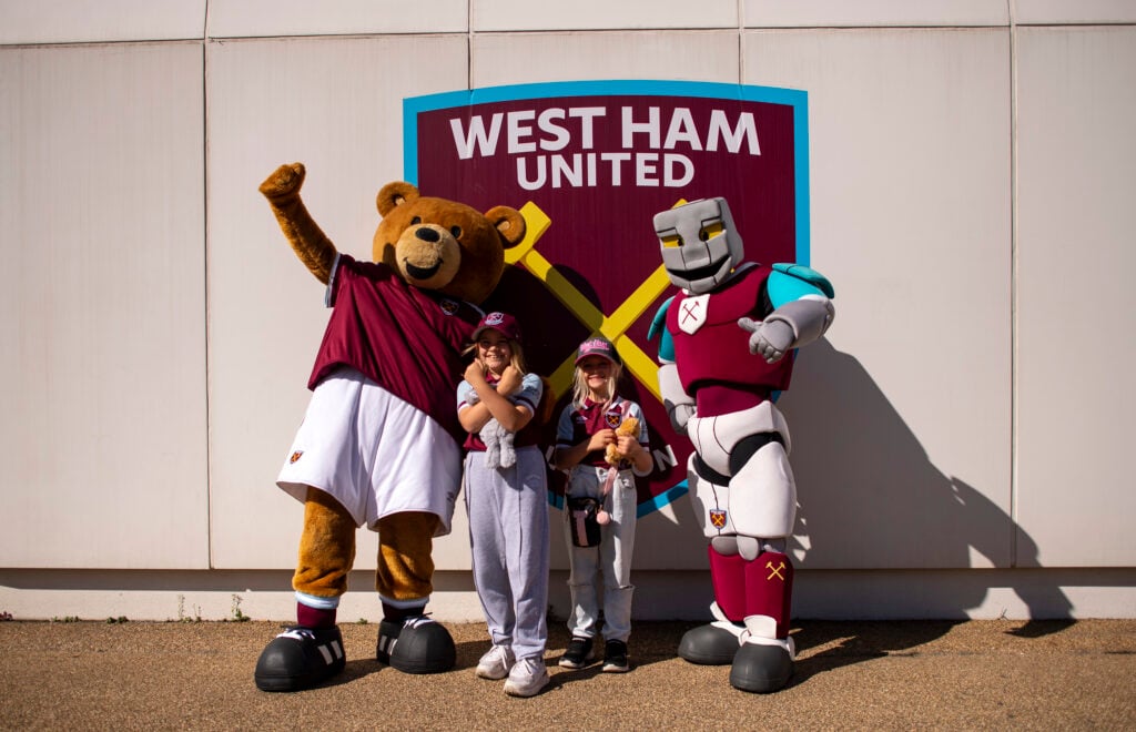 Hammerhead and Bubbles pose with West Ham fans