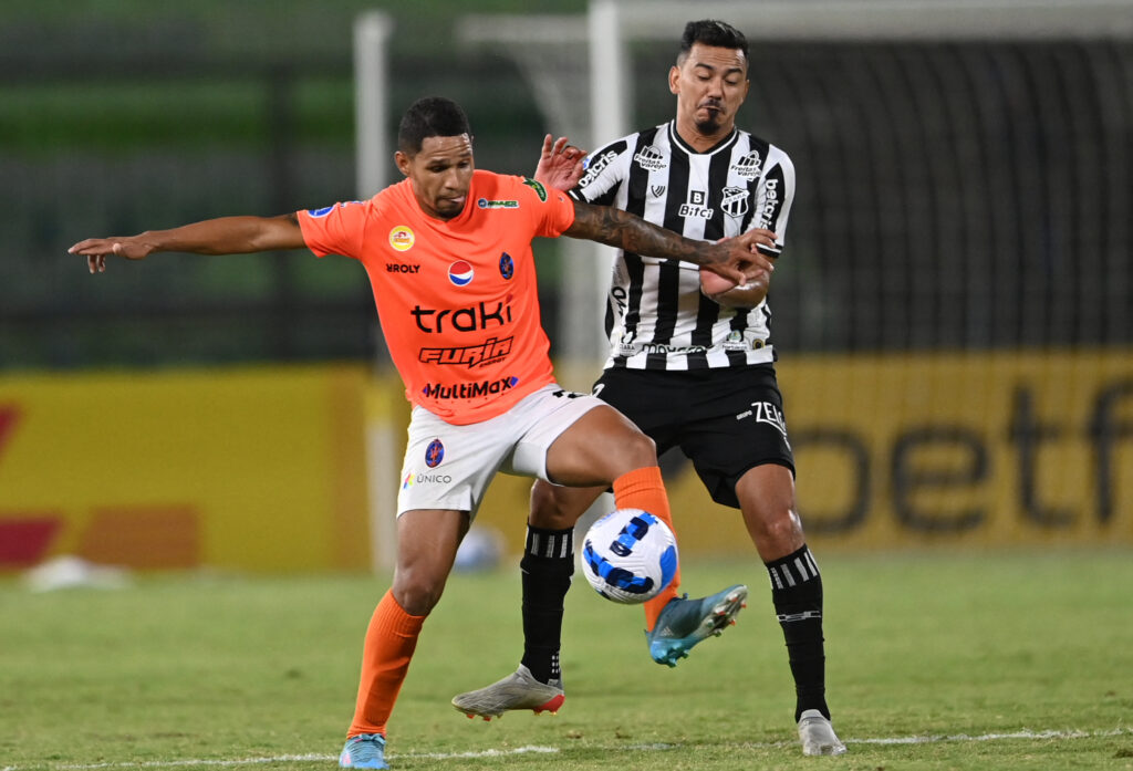 Venezuelan winger Keiber Lamadrid (left) battles for the ball