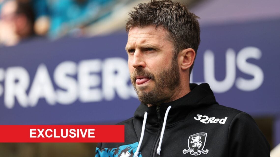 Michael Carrick looks on.