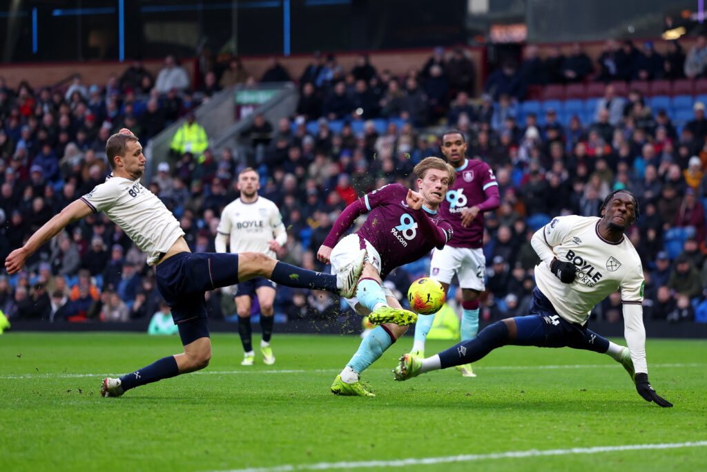 Zian Flemming shoots while under pressure from Tomas Soucek and Axel Disasi - Burnley v West Ham United - Premier League