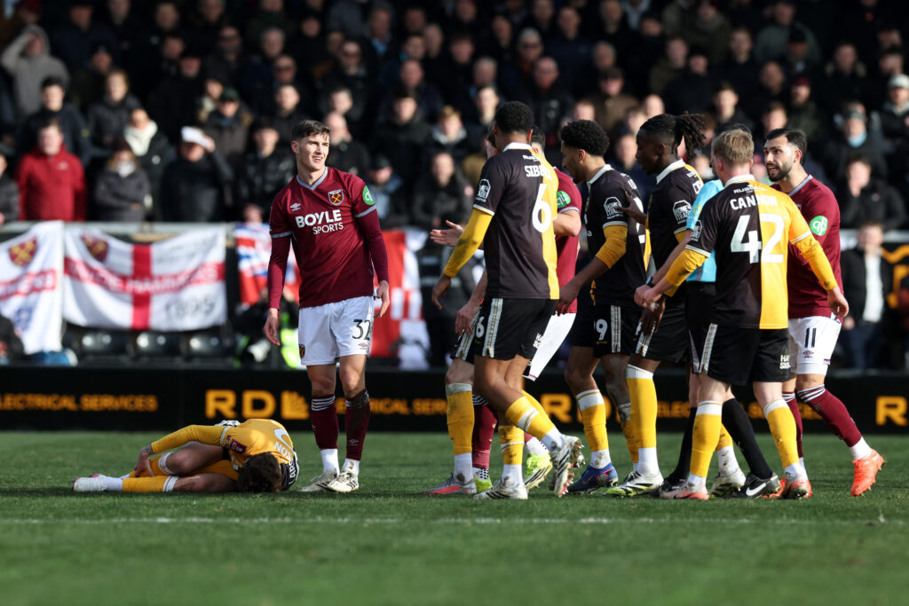 West Ham United's English midfielder #32 Freddie Potts reacts after fouling Burton Albion's Swedish Forward #22 Julian Larsson during the FA Cup fourth round football match between Burton Albion and West Ham United at the Pirelli stadium in Burton Upon-Trent, central England on February 14, 2026. (Photo by Darren Staples / AFP via Getty Images) / RESTRICTED TO EDITORIAL USE. No use with unauthorized audio, video, data, fixture lists, club/league logos or 'live' services. Online in-match use limited to 120 images. An additional 40 images may be used in extra time. No video emulation. Social media in-match use limited to 120 images. An additional 40 images may be used in extra time. No use in betting publications, games or single club/league/player publications. /