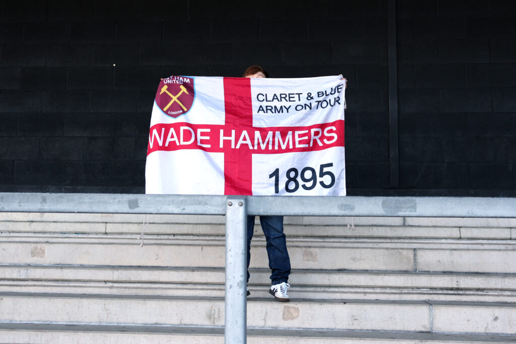 A young West Ham fan holds up a banner before their FA Cup game with Burton.