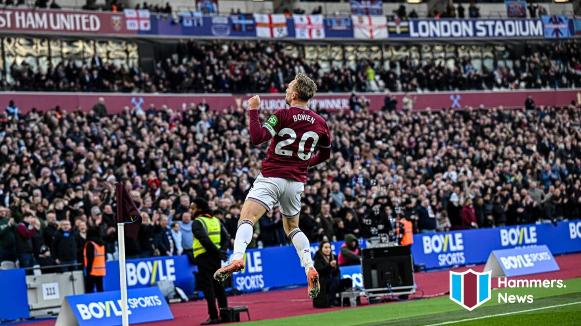 Jarrod Bowen celebrates in front of the West Ham United fans after scoring a goal. A 'Hammers News' site logo has been added.