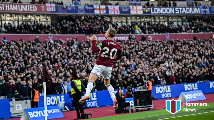 Jarrod Bowen celebrates in front of the West Ham United fans after scoring a goal. A 'Hammers News' site logo has been added.
