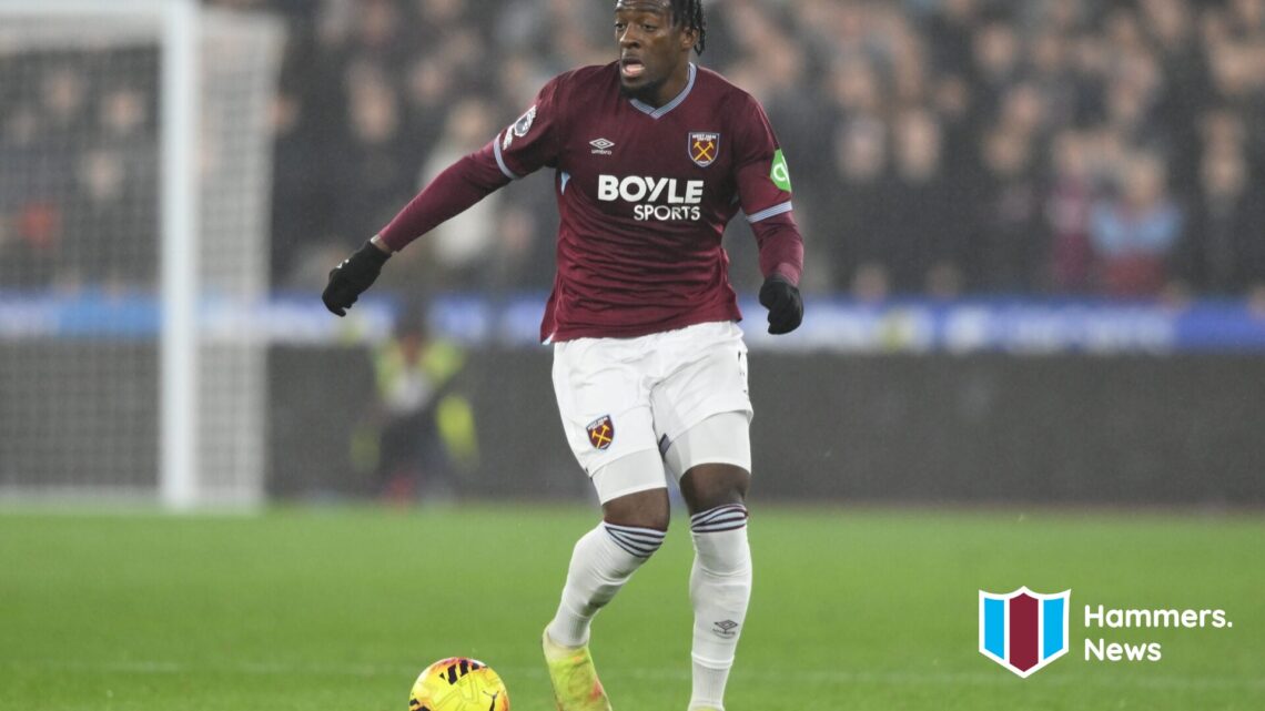 Axel Disasi runs with the ball during West Ham United vs Manchester United. A 'Hammers News' logo has been added.