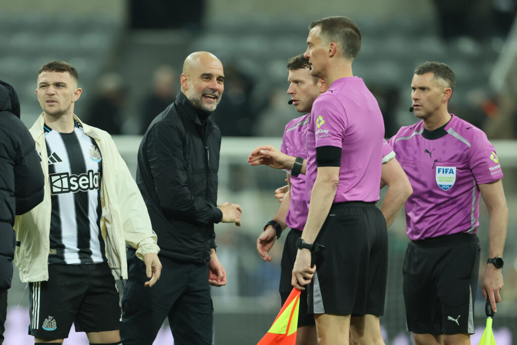 Pep Guardiola speaks to the match officials after Manchester City beat Newcastle United in the FA Cup.