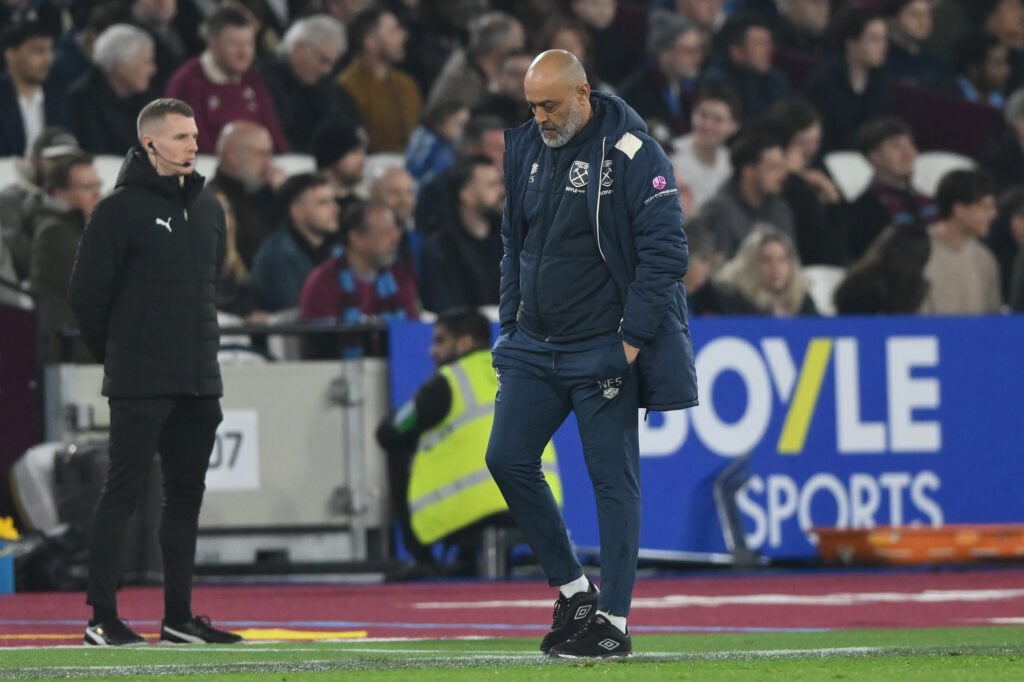 Nuno Espirito Santo looks down at the floor on the touchline during West Ham's FA Cup game against Brentford.