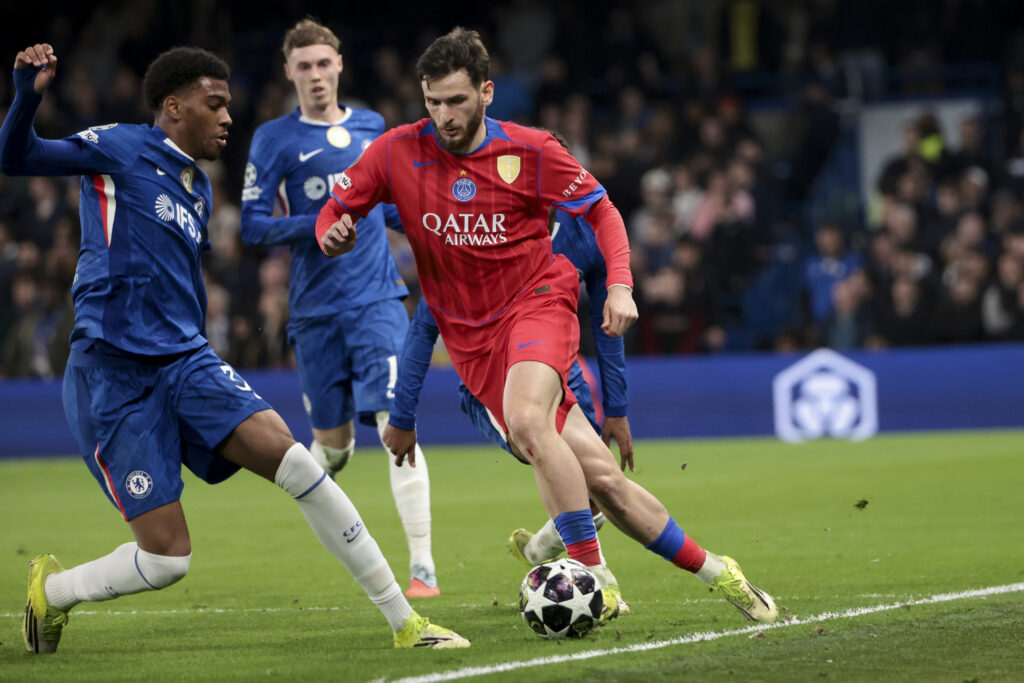 Khvicha Kvaratskhelia and Josh Acheampong during Chelsea FC v Paris Saint-Germain - UEFA Champions League 2025/26 Round of 16 Second Leg