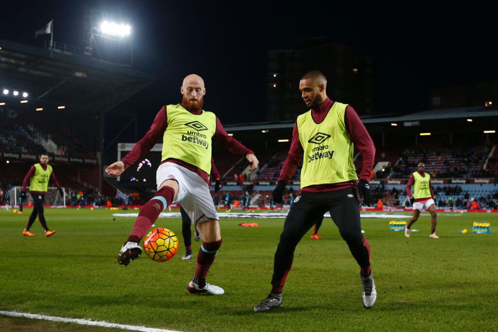 West Ham United's Welsh defender James Collins (L) and West Ham United's New Zealand defender Winston Reid (R) warm up for the English Premier League football match between West Ham United and Manchester City