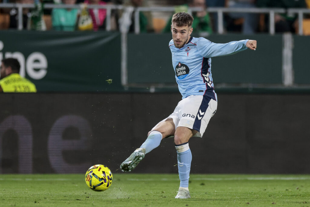 Oscar Mingueza of RC Celta de Vigo makes a pass during the La Liga EA Sports match between Real Betis and RC Celta de Vigo at La Cartuja Stadium
