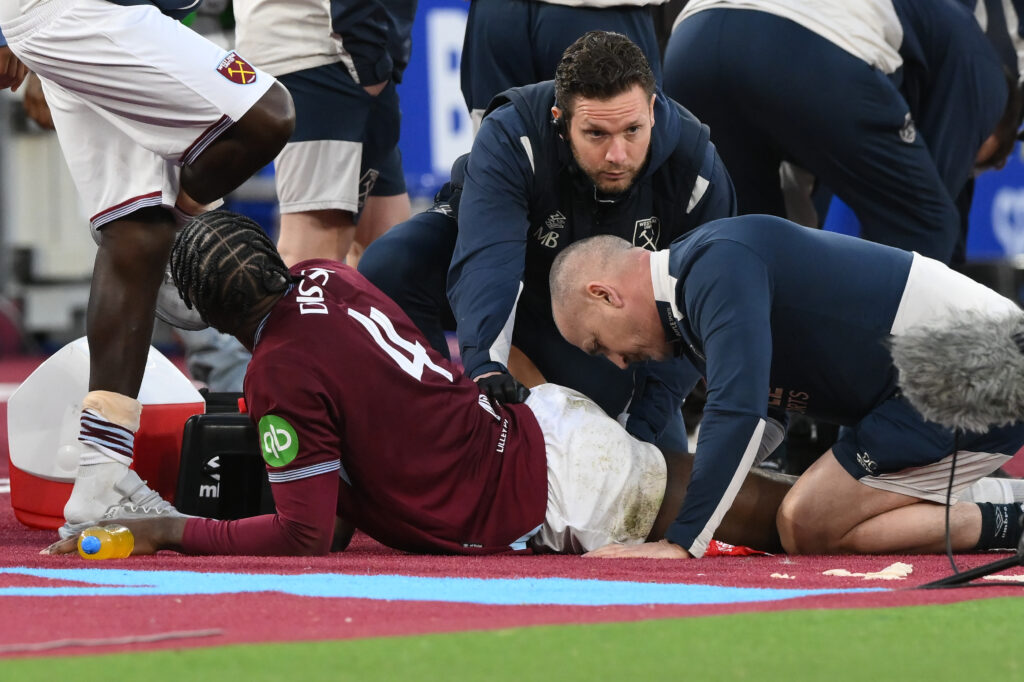 Axel Disasi of West Ham United receives medical treatment