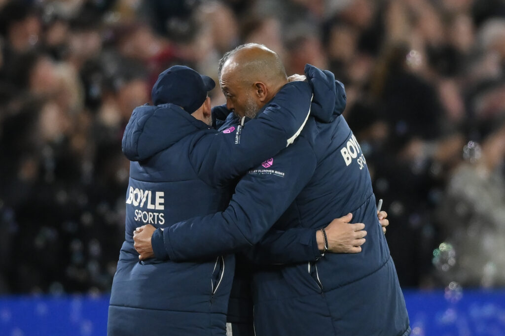 Nuno Espirito Santo celebrates with the West Ham coaching staff after the team score against Wolves in the Premier League.