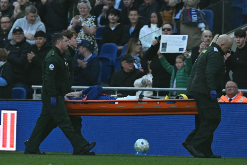 Everton's English defender Jarrad Branthwaite reacts as he leaves on a stretcher during the clash with Liverpool