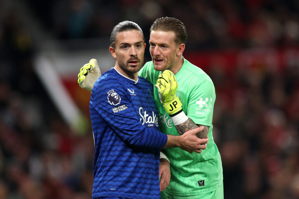 Jordan Pickford and Jack Grealish in action for Everton