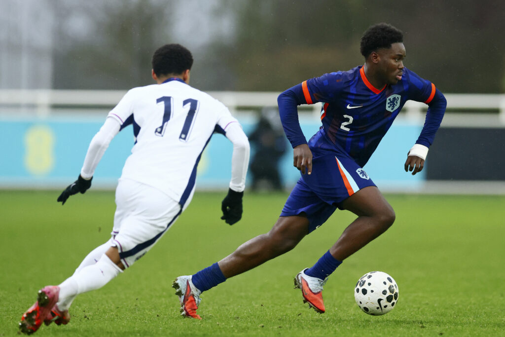 (L-R) Emerson Nwaneri of England U16, Emmanuel Fejokwu of Holland U16 during the U16 Men match between England U16 v Holland U16 at the ST Georges Park