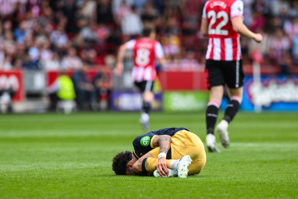 Pablo Felipe lies on the ground after a challenge during the Premier League match between Brentford and West Ham United