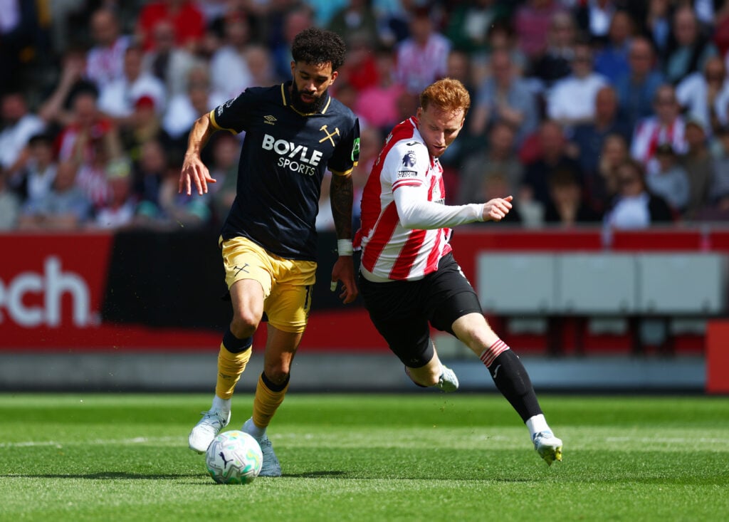 Pablo is challenged by Sepp van den Berg during Brentford v West Ham United - Premier League