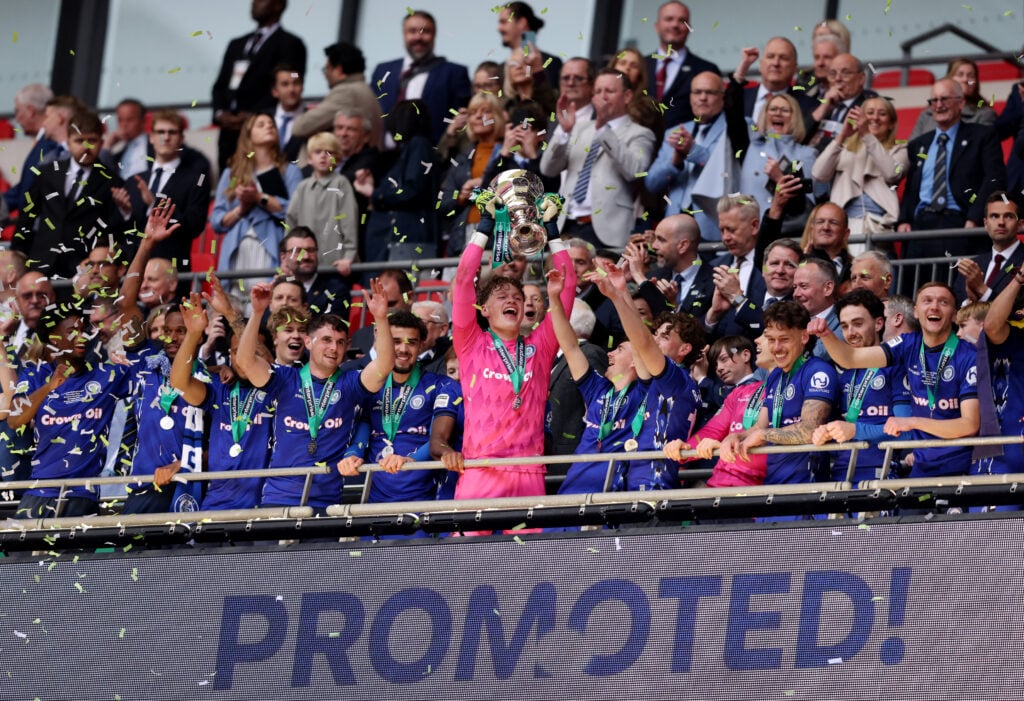 Oliver Whatmuff of Rochdale celebrates with the play off trophy following the Enterprise National League Promotion Play-off Final match between Rochdale and Boreham Wood