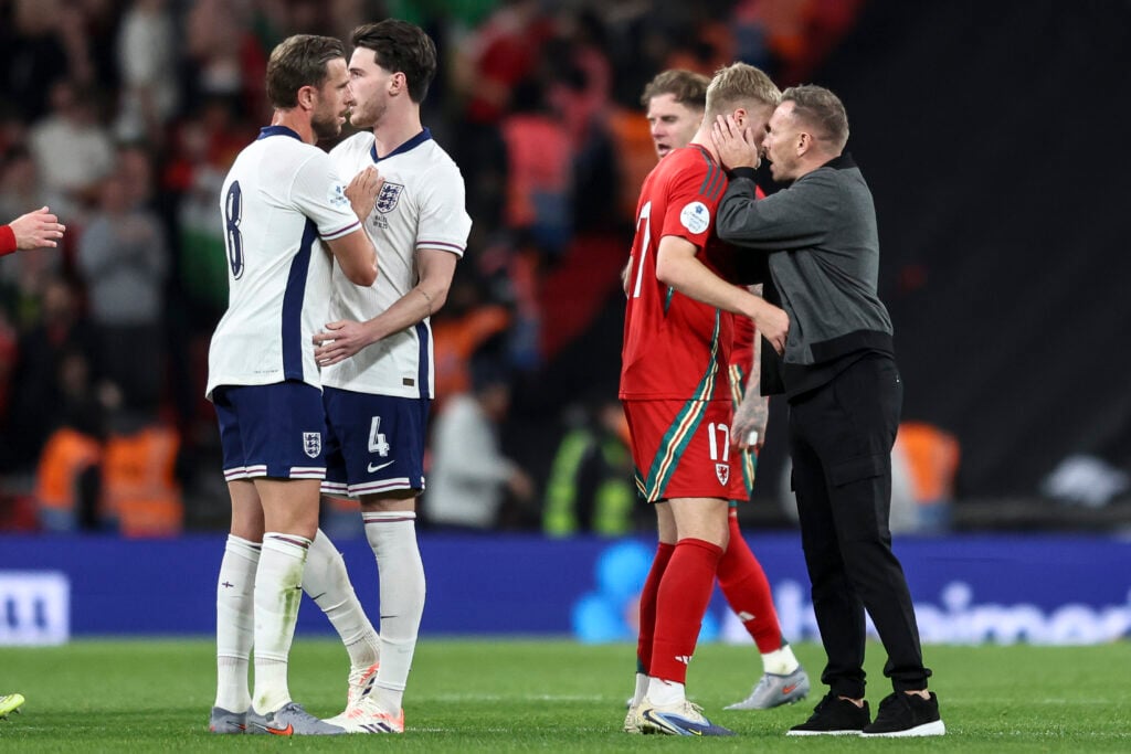 Wales Head Coach Craig Bellamy with Jordan James after he faced former West Ham captain Declan Rice