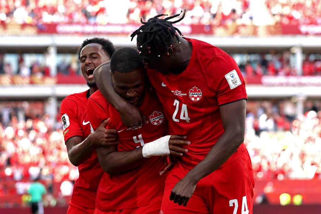 Cyle Larin #9 of Canada celebrates with Promise David - Canada v Bosnia and Herzegovina: Group B - FIFA World Cup 2026