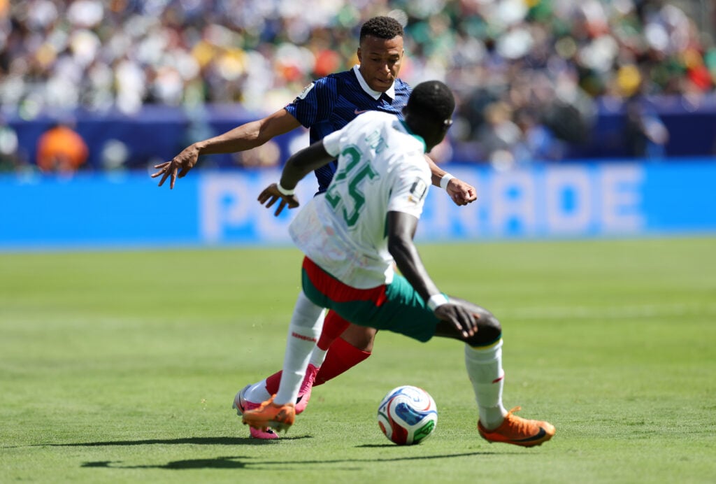 El Hadji Malick Diouf vies with Kylian Mbappe - France v Senegal: Group I - FIFA World Cup 2026