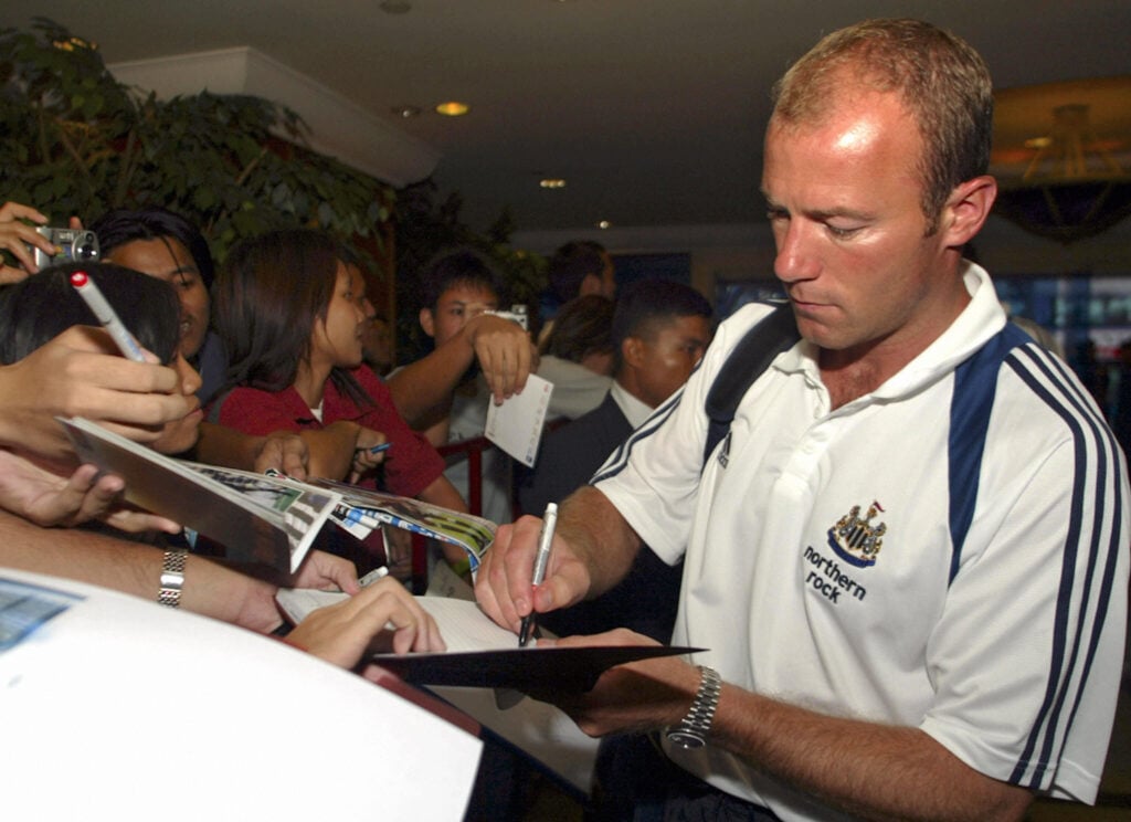Former England and Newcastle captain Alan Shearer signs autographs